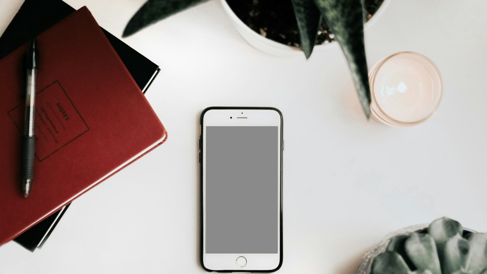 photo of iPhone on white surface