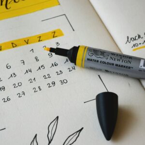 black marker on notebook