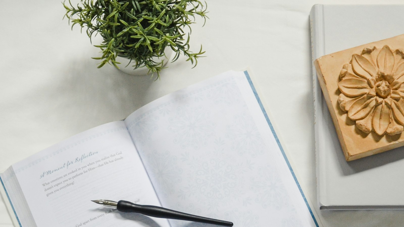 a pair of scissors and a notebook