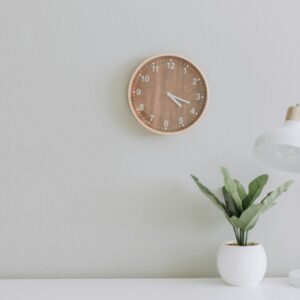 white desk lamp beside green plant