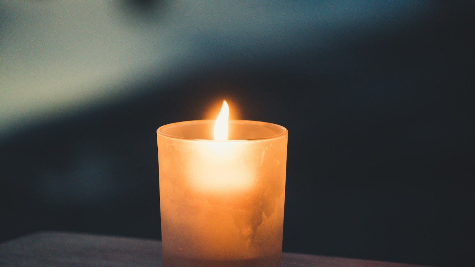 tea light on brown surface