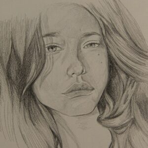 womans face sketch on white paper