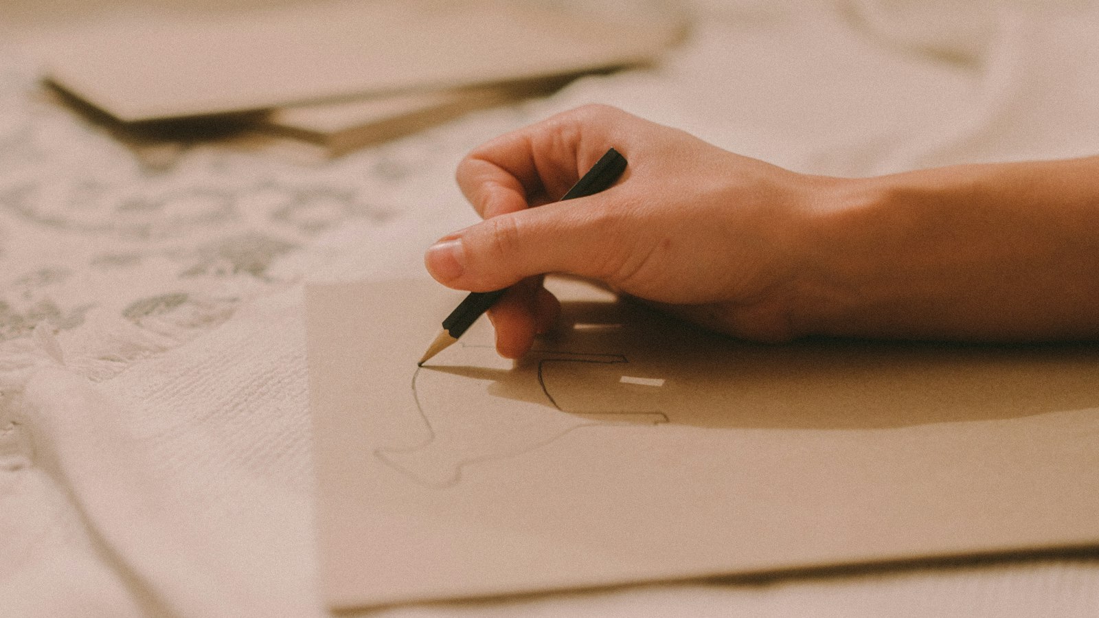 person writing on white paper