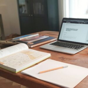 macbook air on brown wooden table