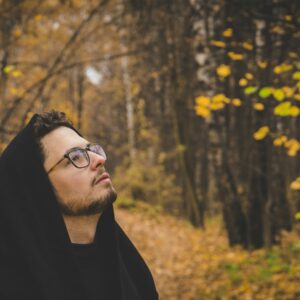 man in black hoodie wearing black framed eyeglasses