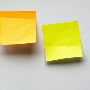 yellow sticky notes on white wall