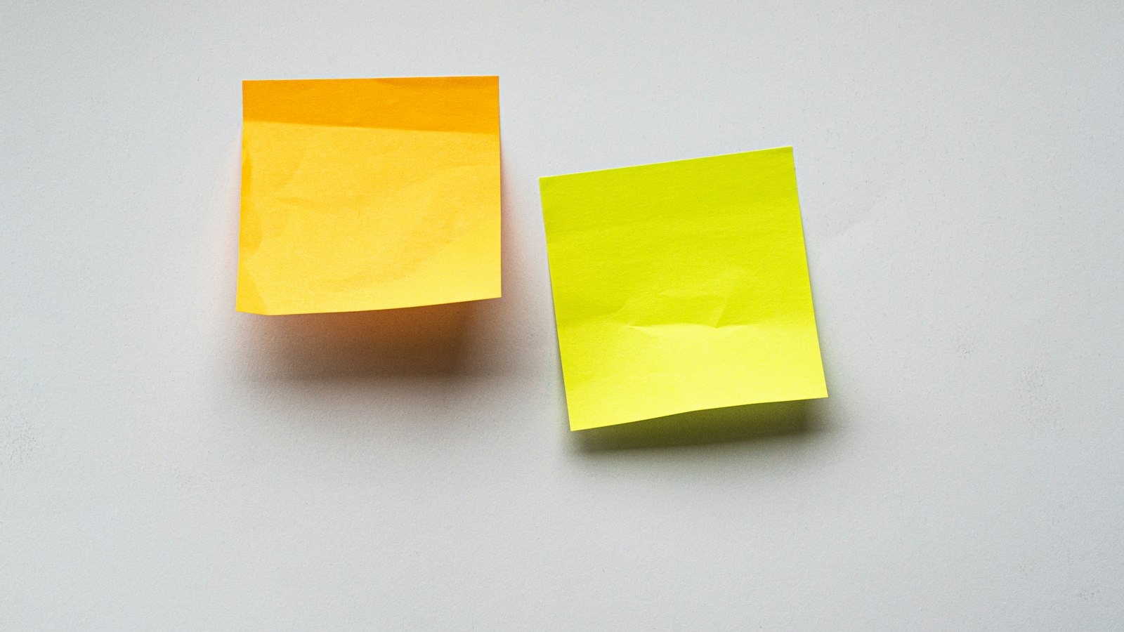 yellow sticky notes on white wall