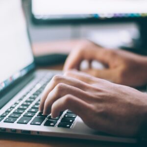 person using MacBook Pro