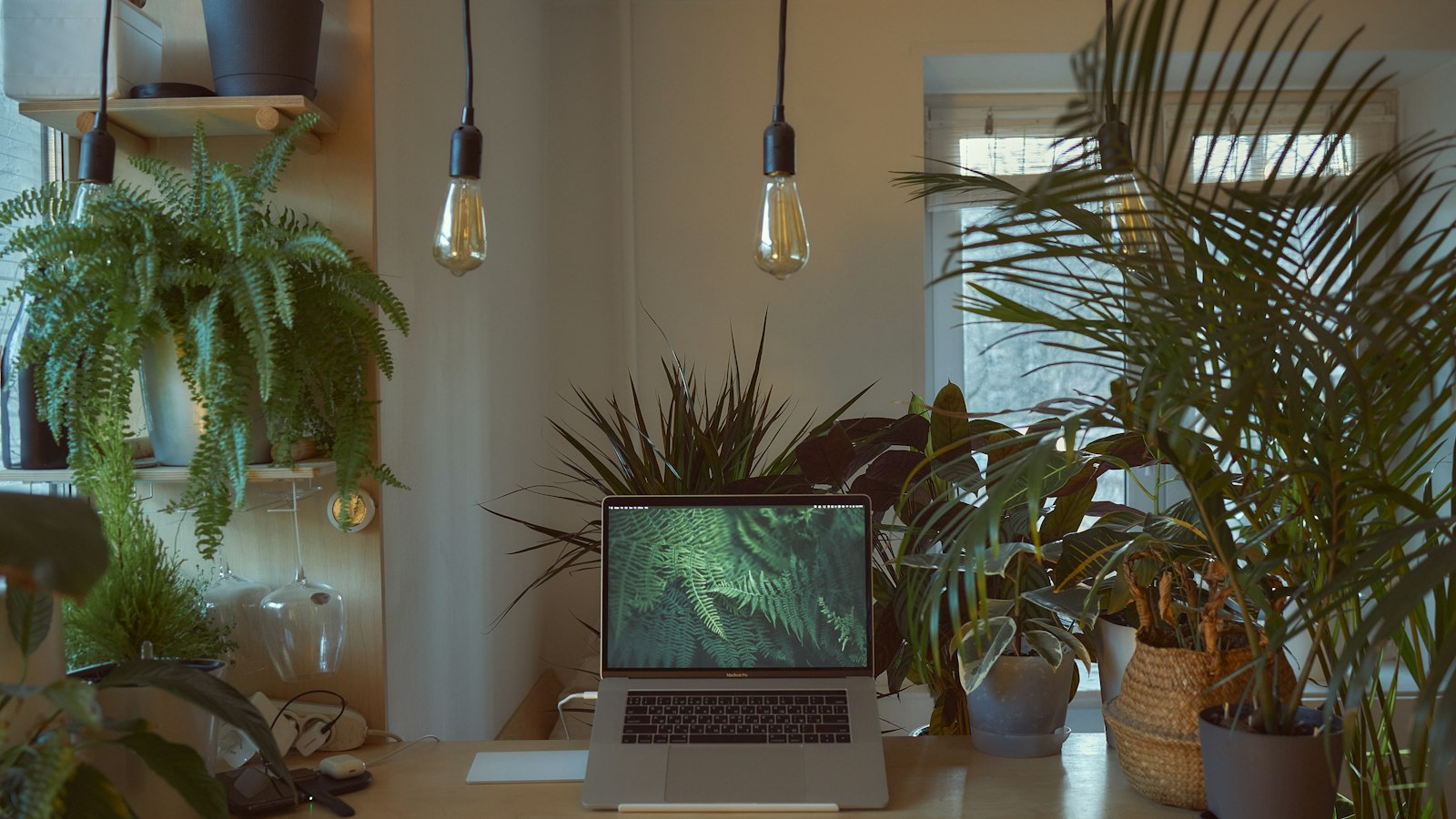 macbook pro on white table