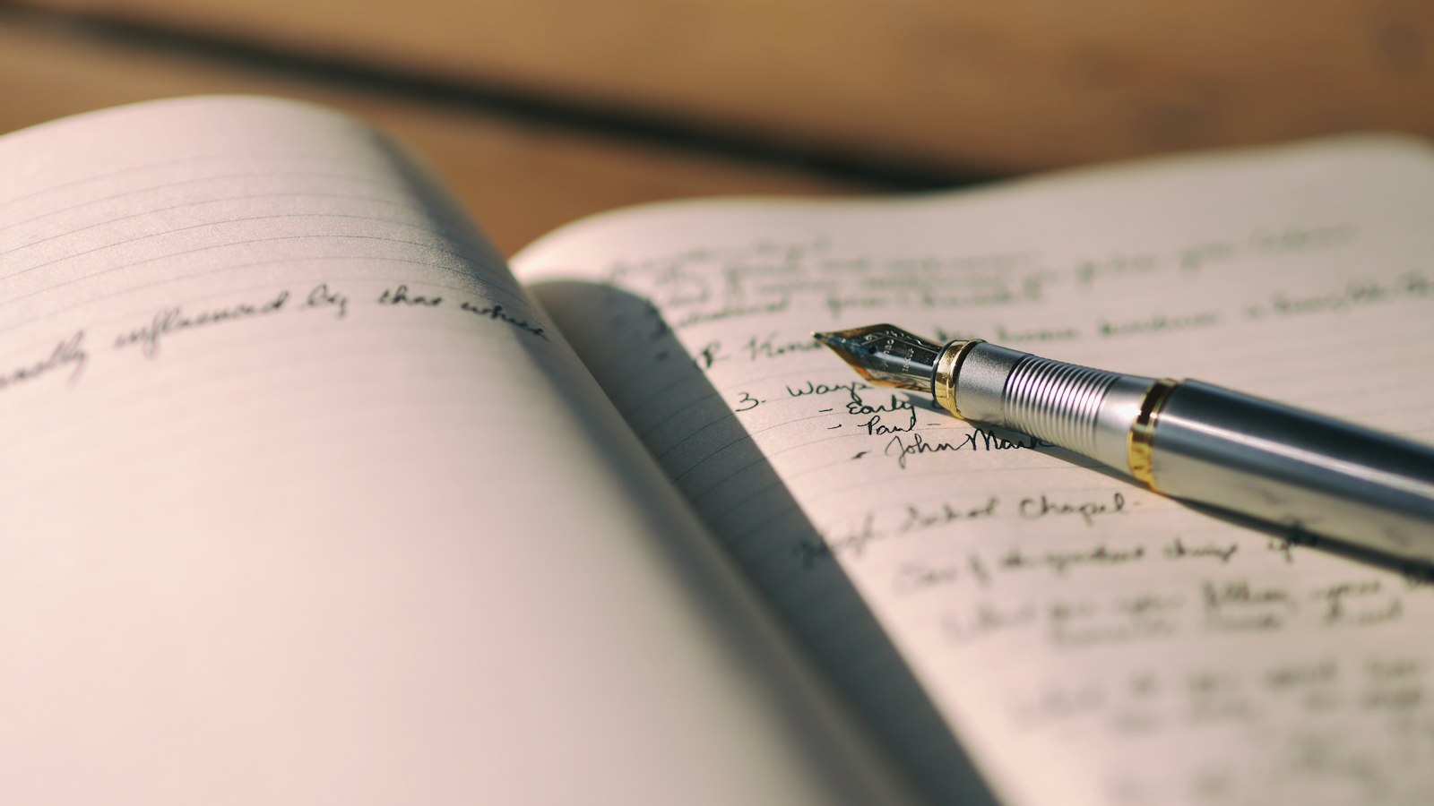 pen on white lined paper selective focus photography