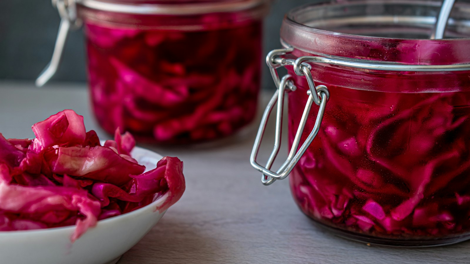red liquid in clear glass jar