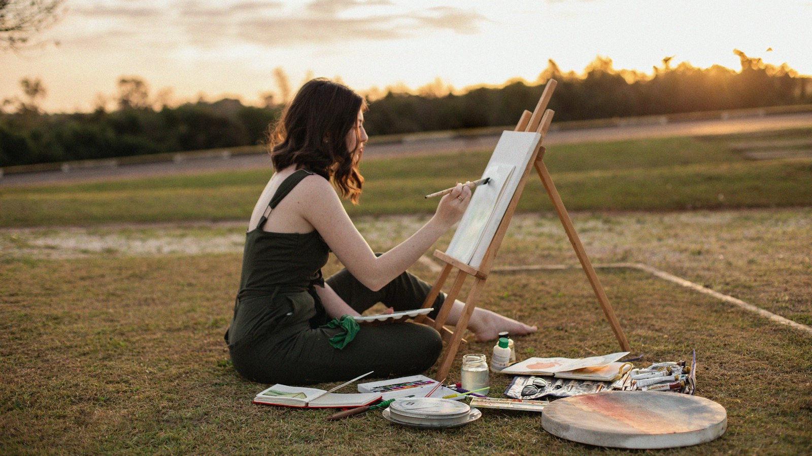 a woman painting outside