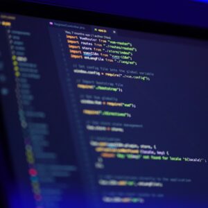 laptop screen displaying colorful code