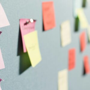 colorful sticky notes pinned to board