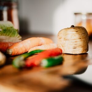 sliced vegetables on brown wooden chopping board