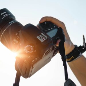 a person holding a camera up to take a picture