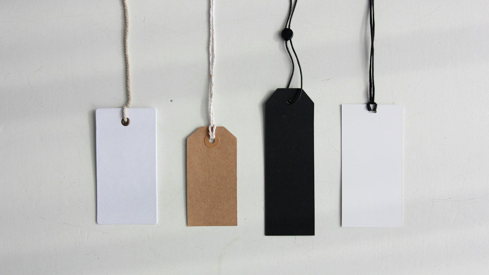 four paper card tags