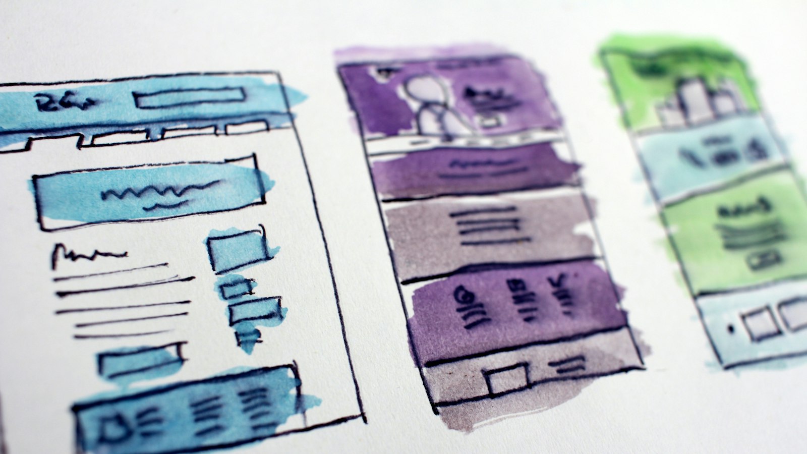 watercolor wireframe sketches of website layouts