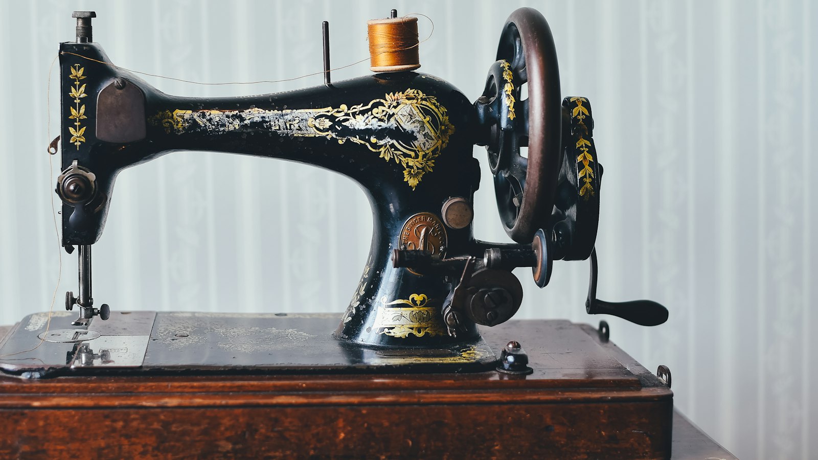 black and yellow metal sewing machine