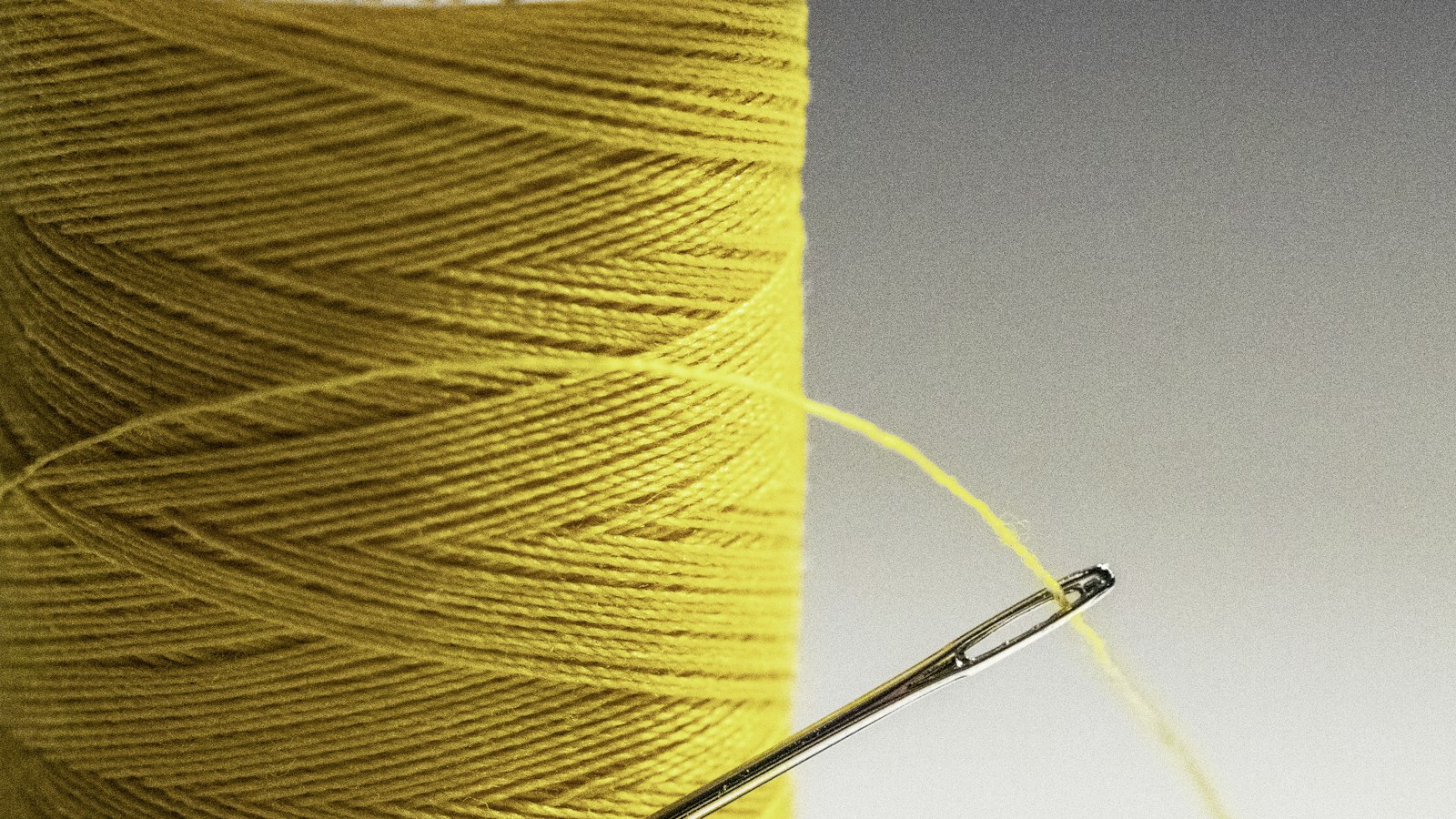 yellow thread on white paper