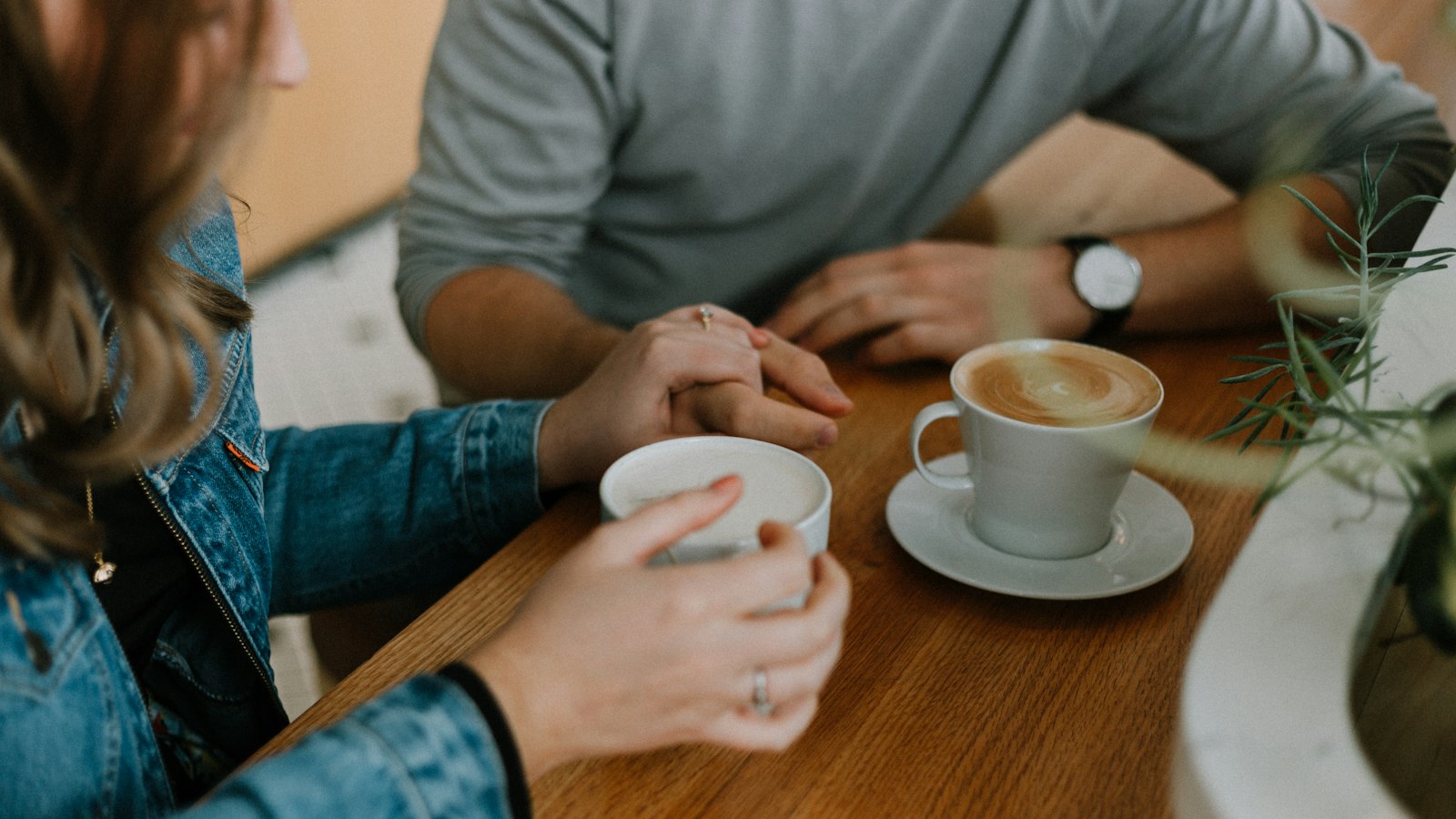 two mugs with coffee on table