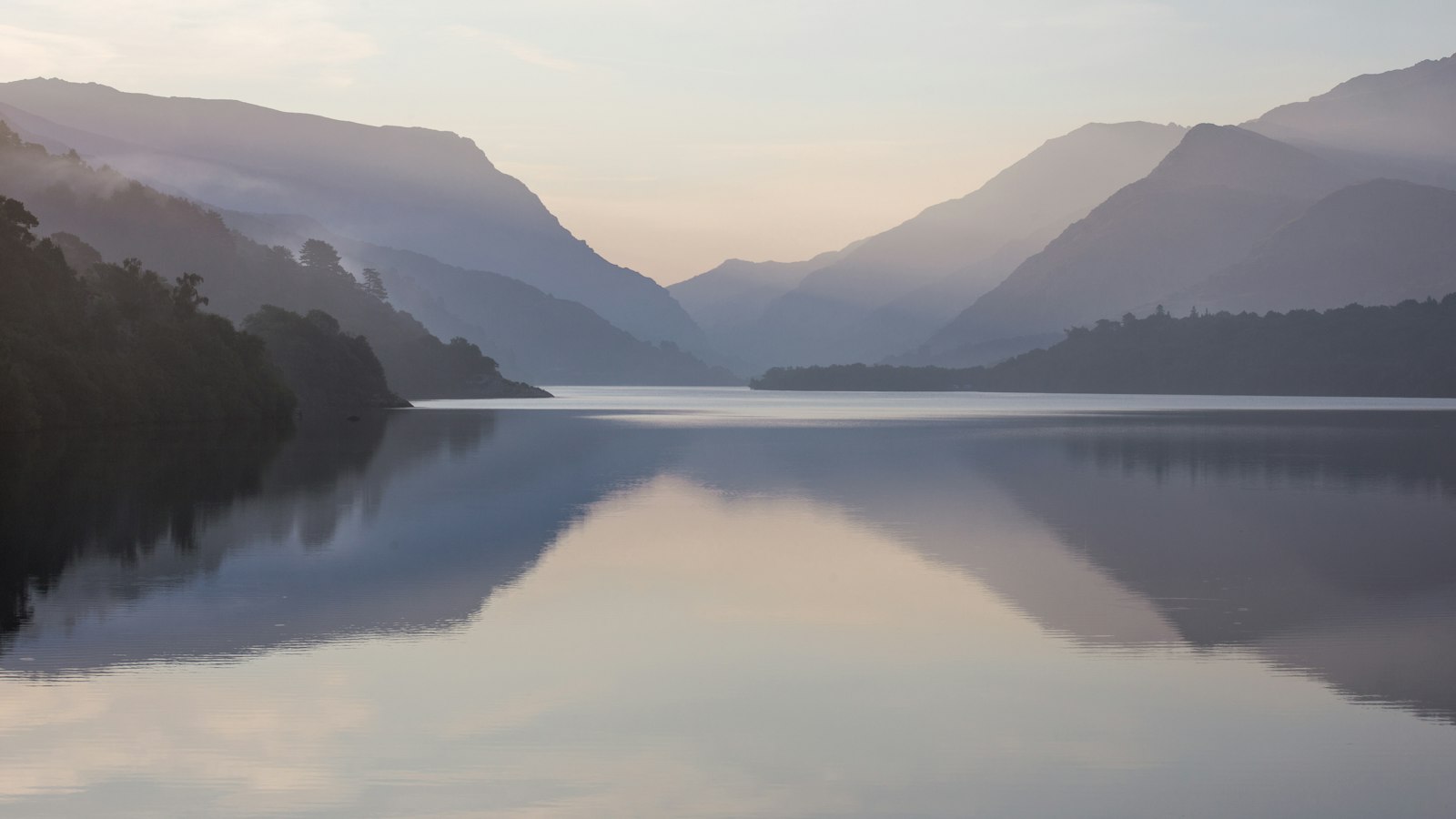mountain near body of water during daytime