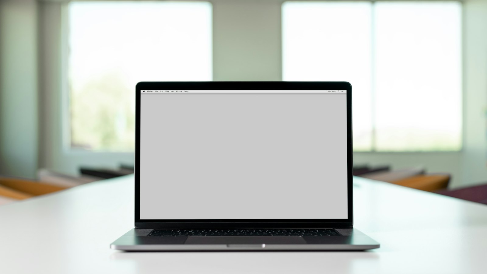macbook pro on white table