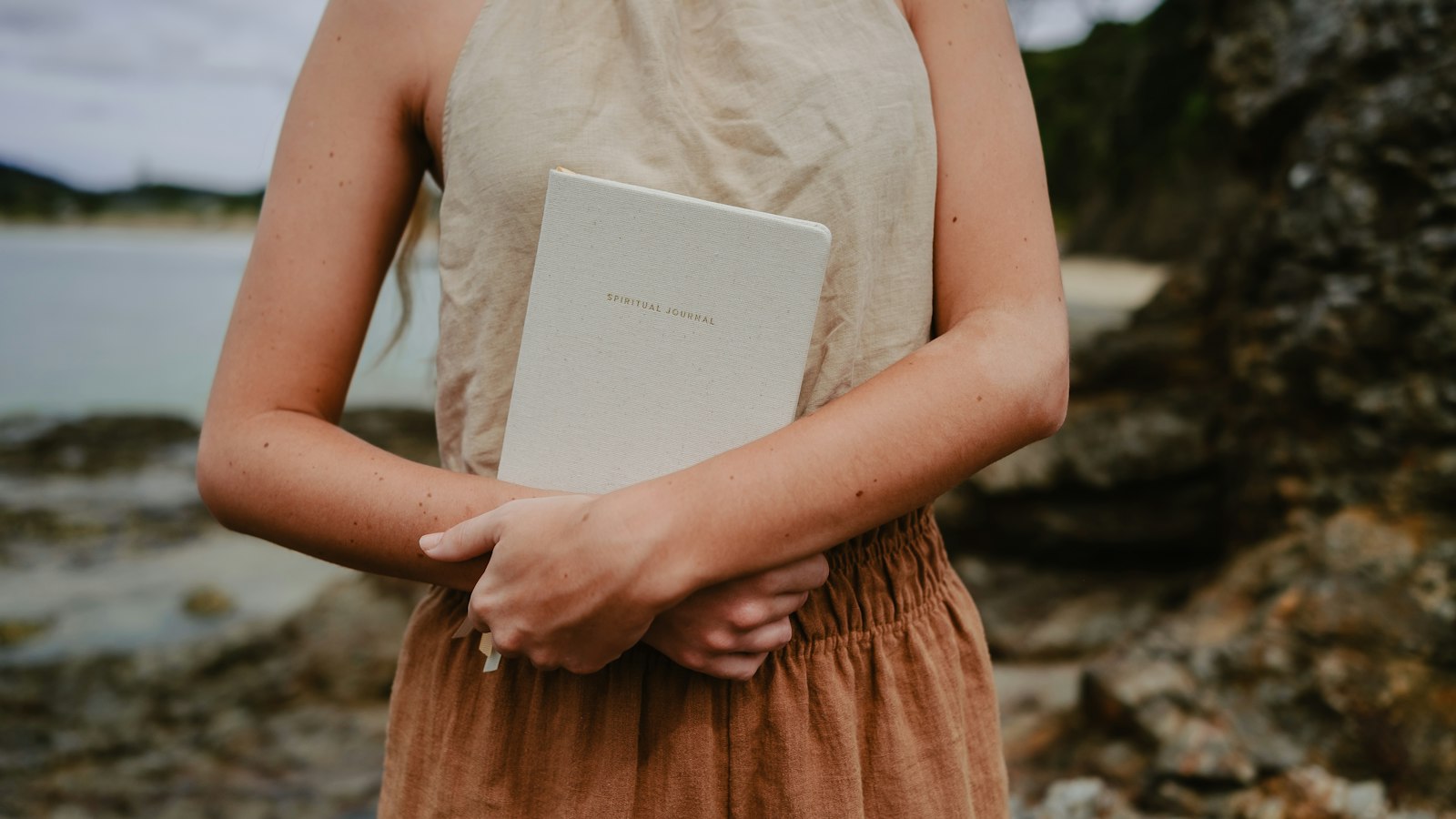 a woman holding a book in her hands