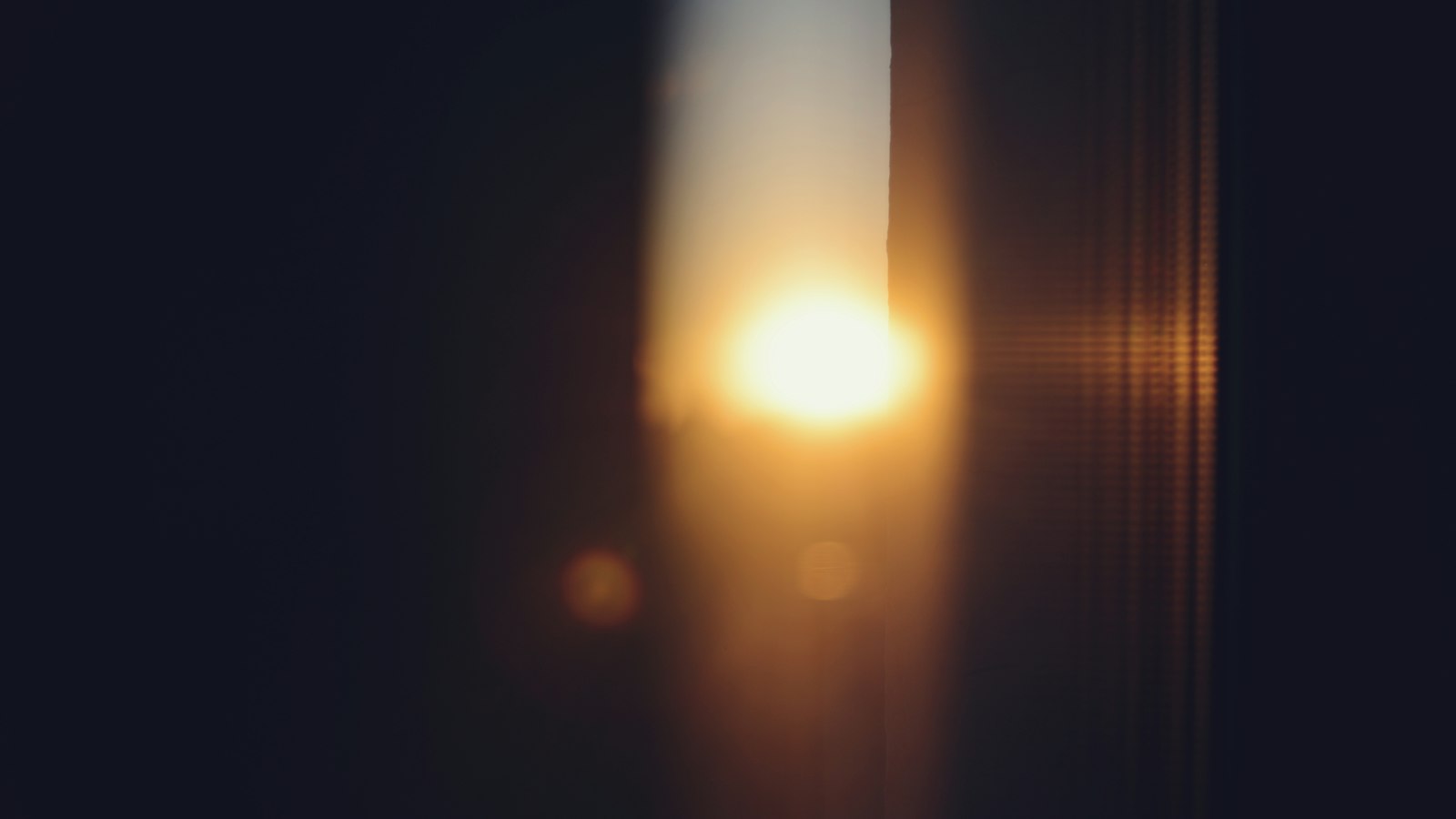 The sun is shining brightly through a window