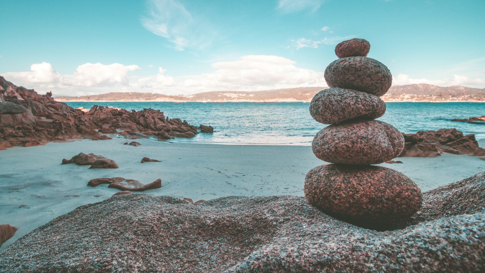 gray rocks on seashore during daytime
